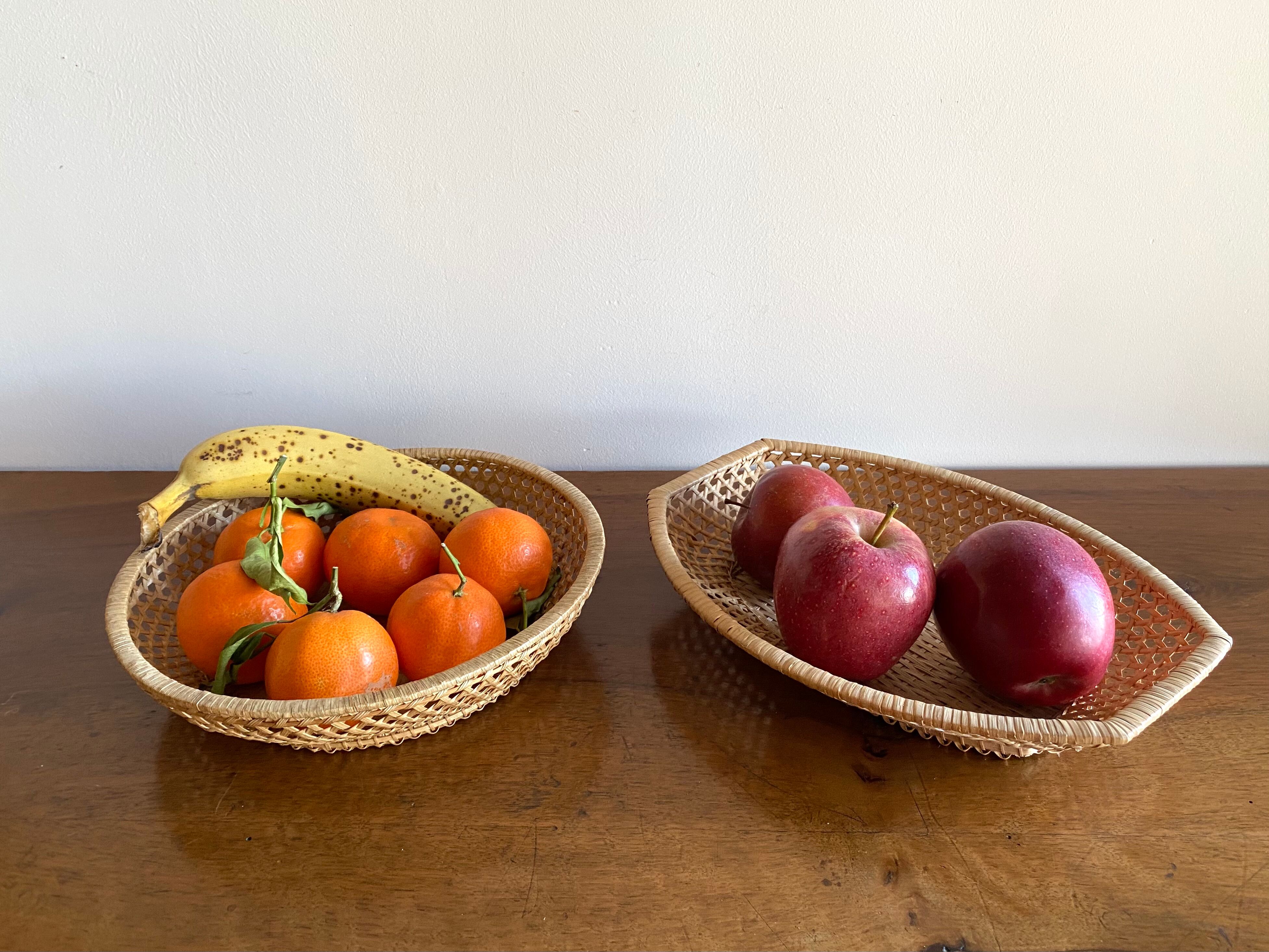 Pair of vintage braided rattan baskets
