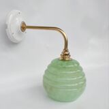 Brass collar and speckled glass wall lamp