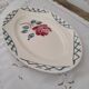 Oval dish in half-porcelain Badonviller red pink decoration and light gray blue braces