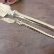 Golden metal sugar tongs