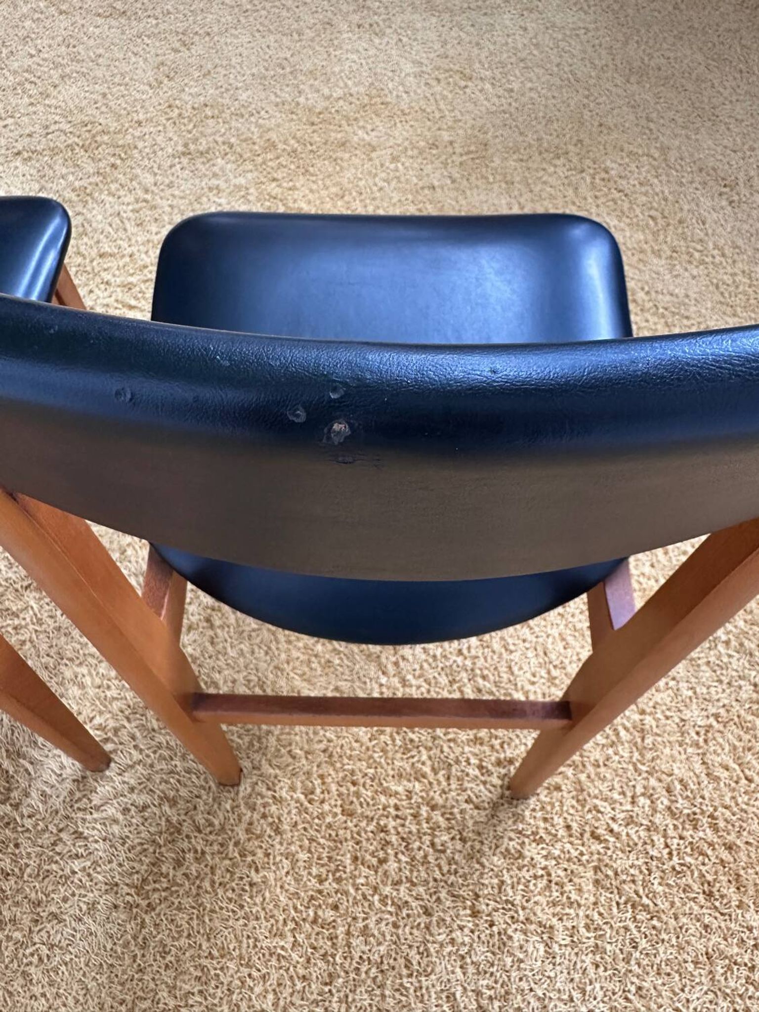 4 Scandinavian chairs in teak and black faux leather.