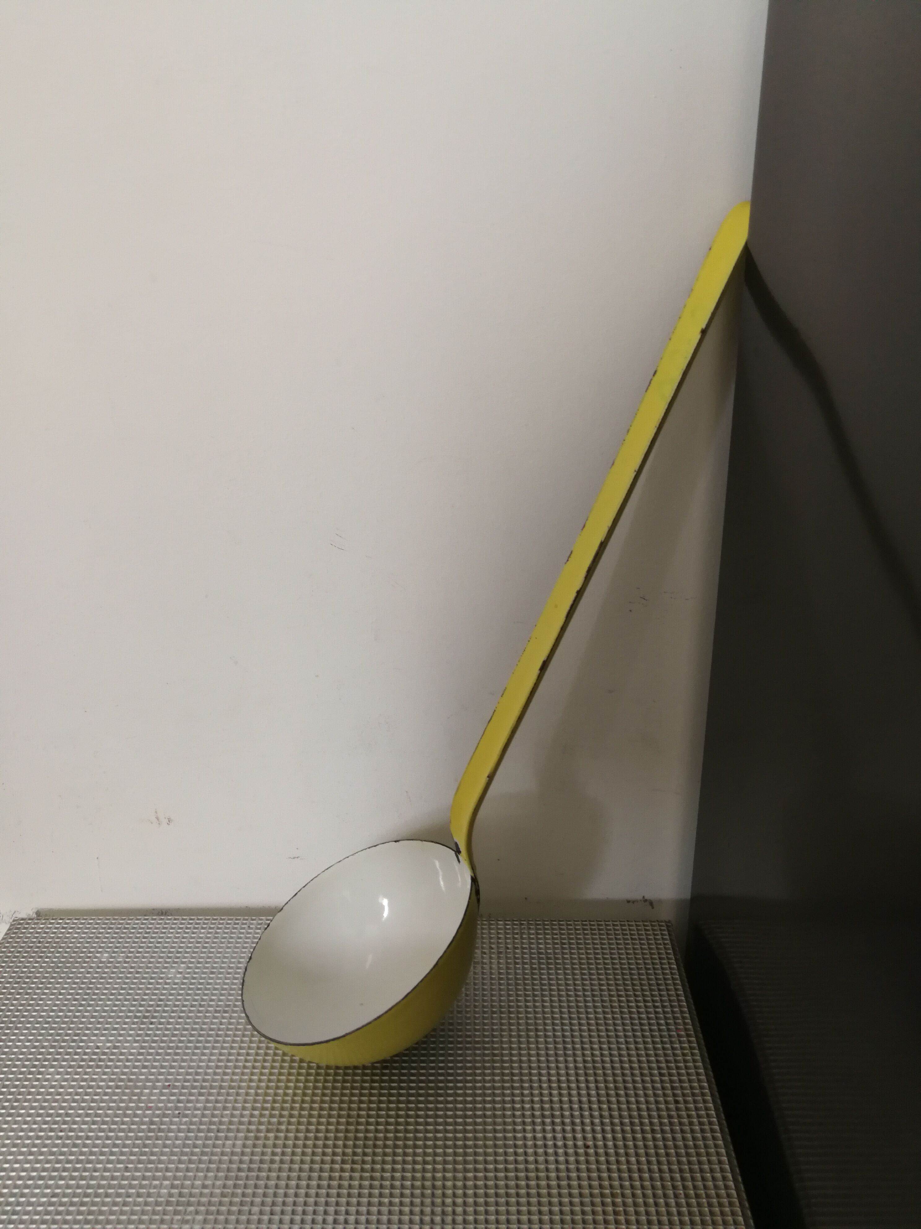 Vintage yellow enamelled ladle