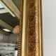Gilded mirror with frieze h2m10 l:73cm