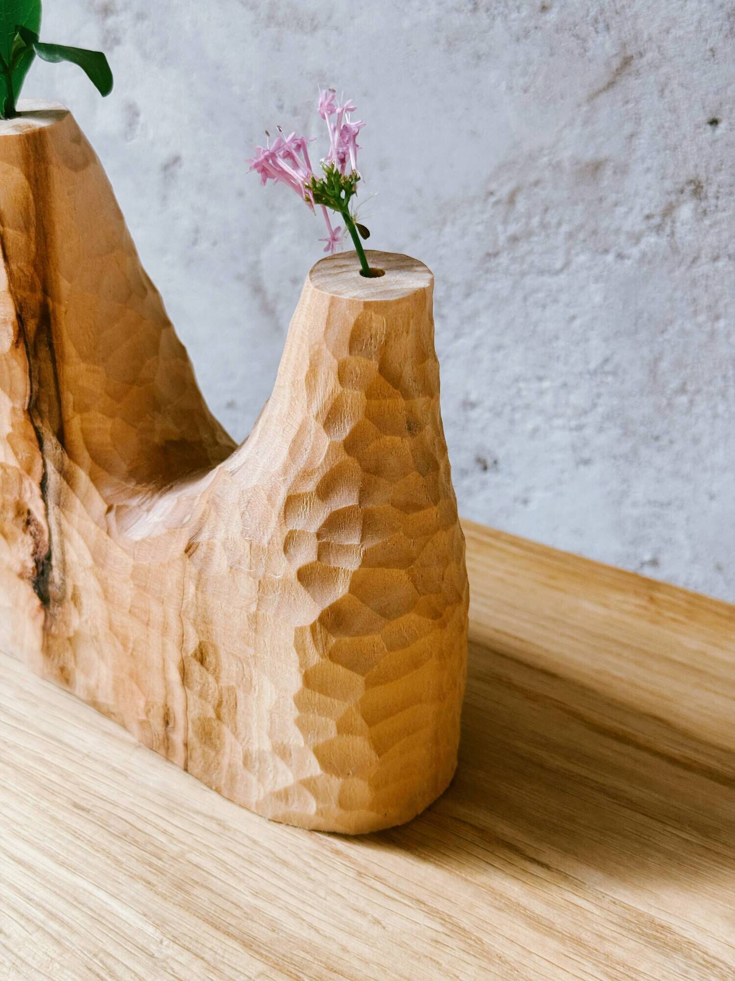 Hand-carved soliflore vase in solid lime wood.