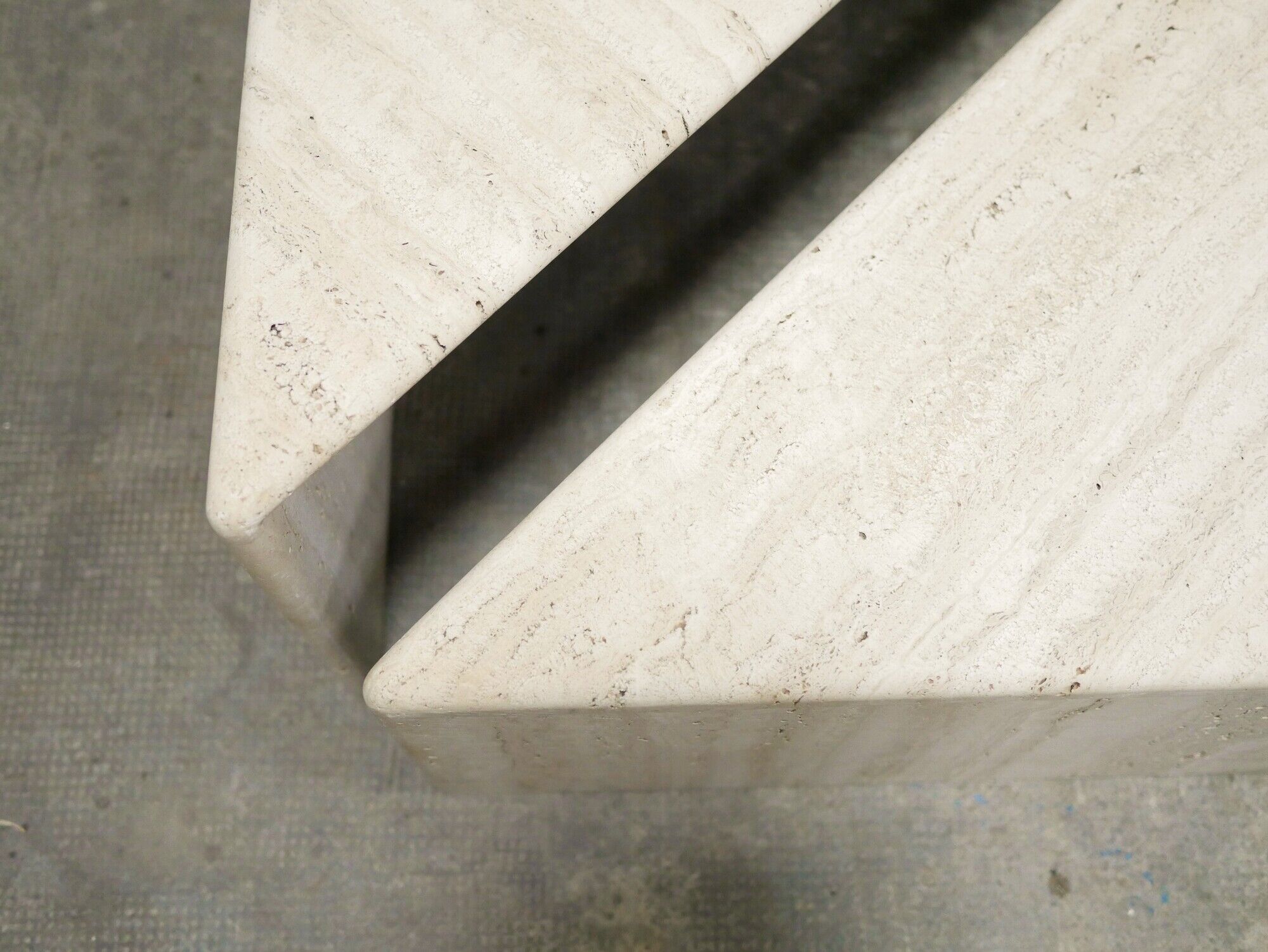 Series of 2 vintage travertine coffee tables published by Roche Bobois