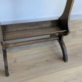 Old wooden pocket emptying table with drawer and planter.
