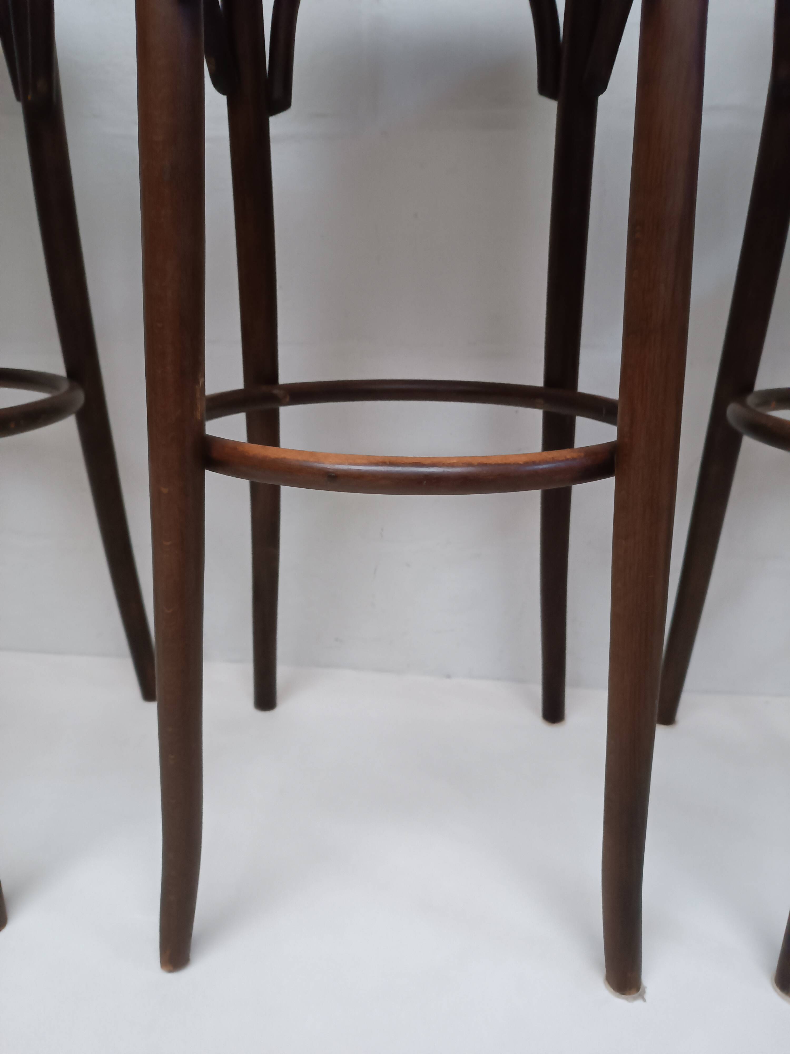 4 curved wood and cane bar stools