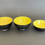 Two pitchers and three Elchinger ceramic bowls black and yellow background 1960