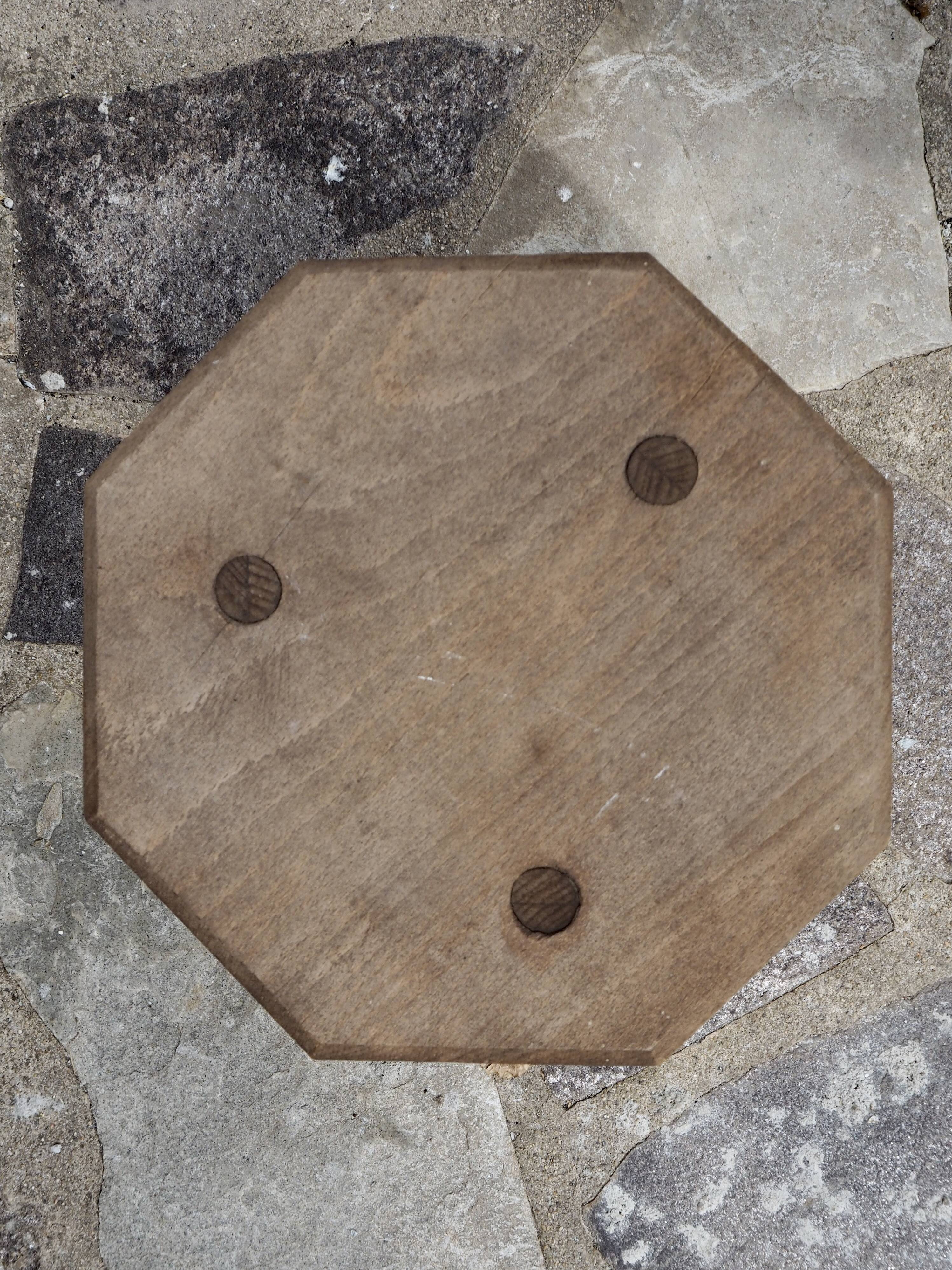 Raw wood tripod stool with octagonal seat