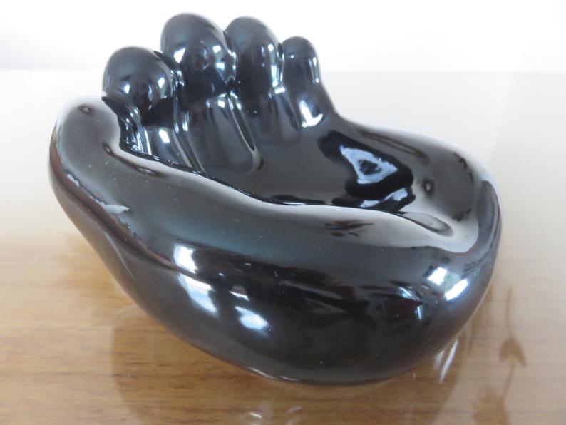 "hand" in black ceramic trinket bowl 60/70