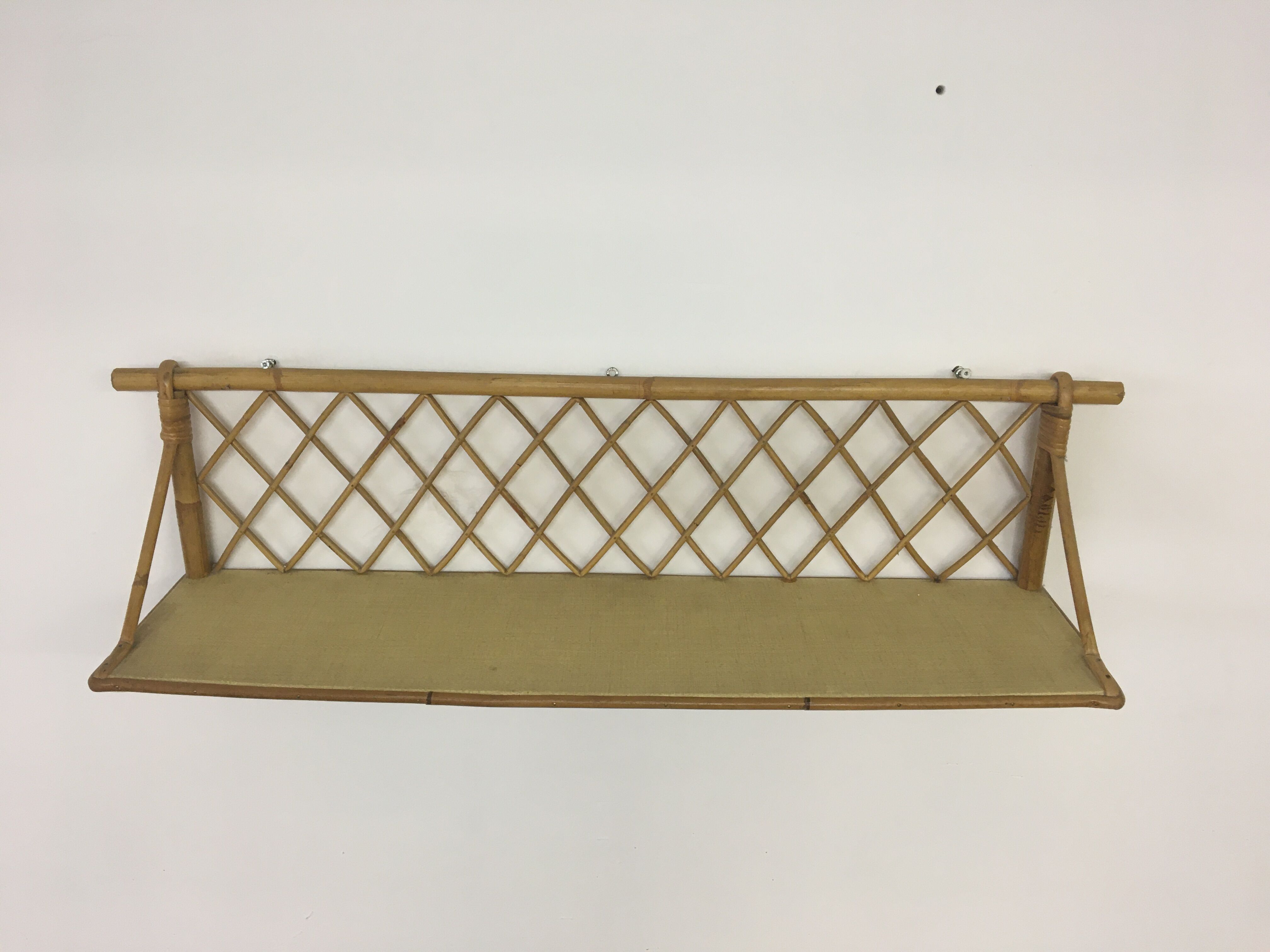 Wall shelf in rattan 50s