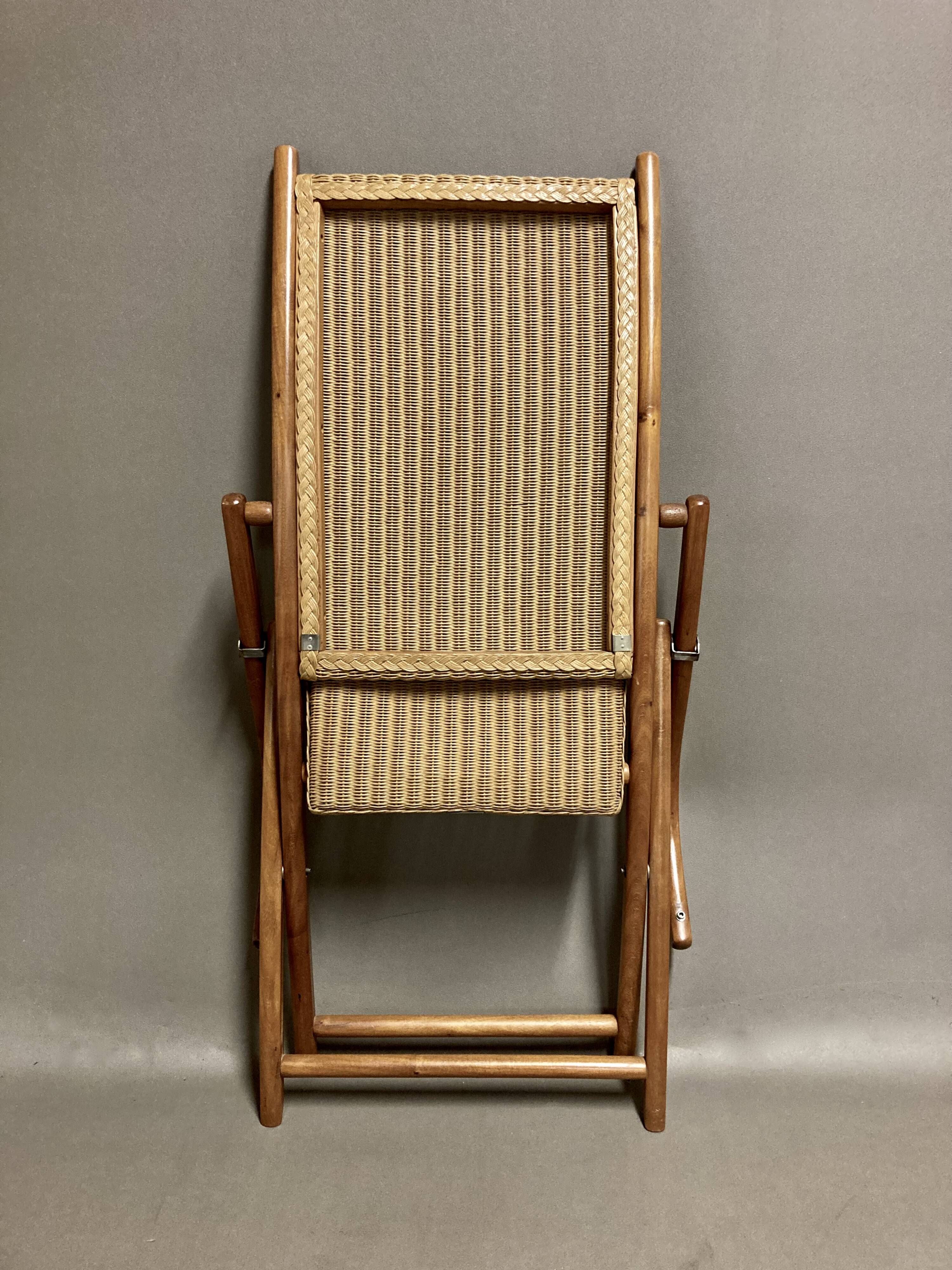 Foldable rattan armchair design 1960.
