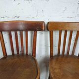 4 mismatched signed bistro chairs