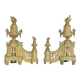 Pair of gilded brass fire dogs decorated with fire pots in the Louis XVI style.