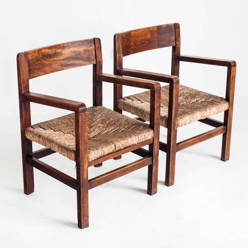Pair of rustic armchairs in solid wood and straw seats. France, 1940s