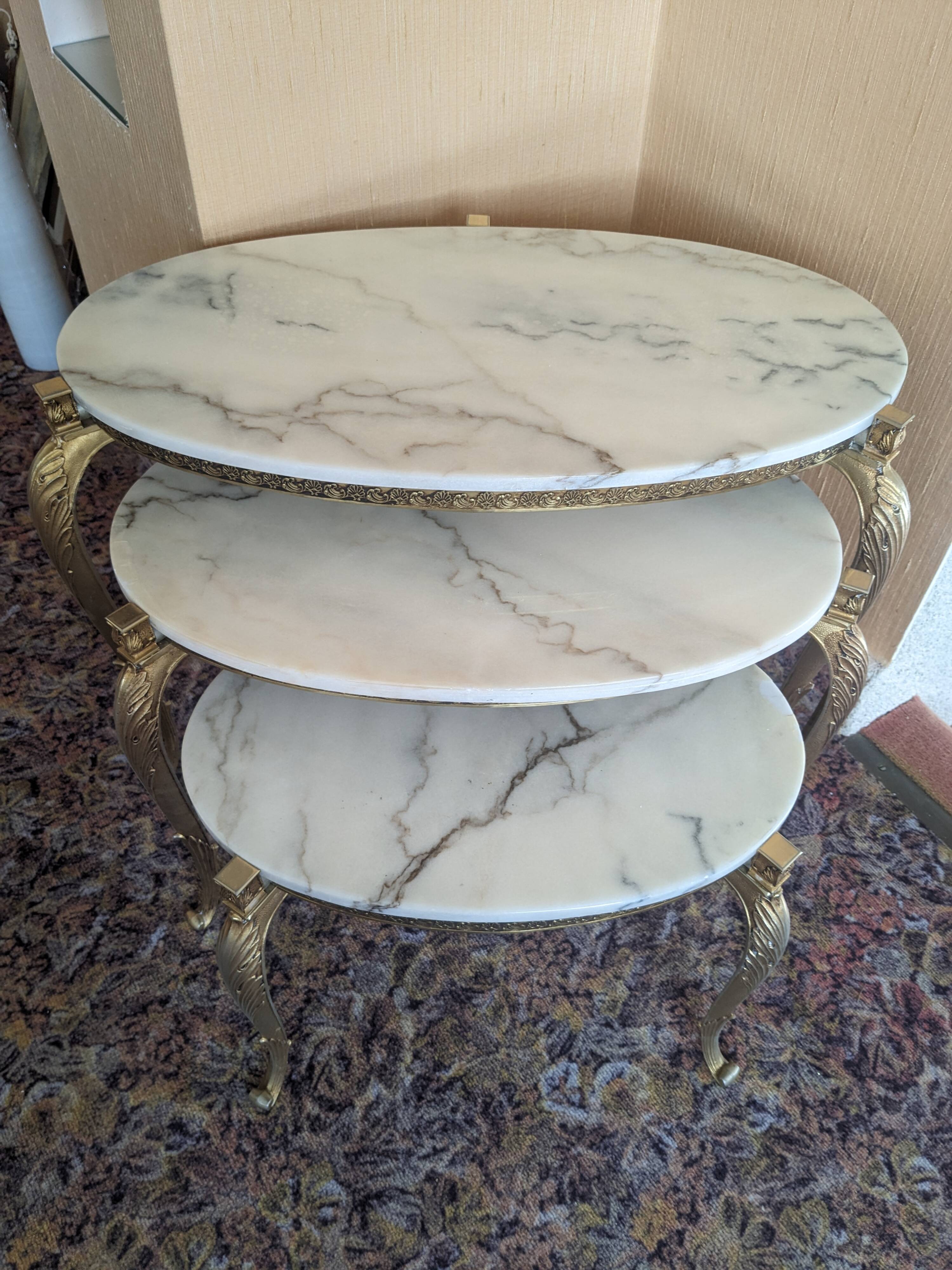 Nesting tables in white marble and bronze