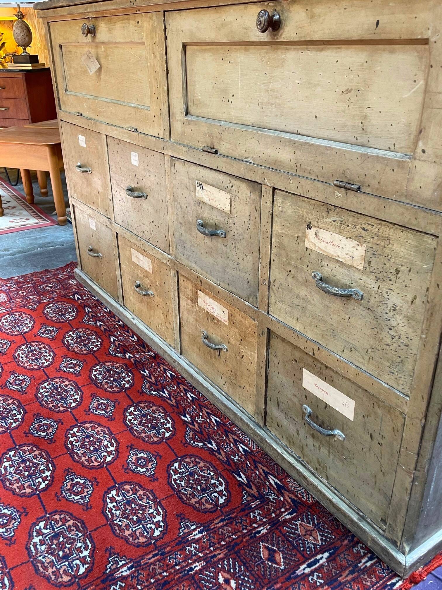 Old workshop furniture in good condition. 8 drawers and 2 drop-down doors, very