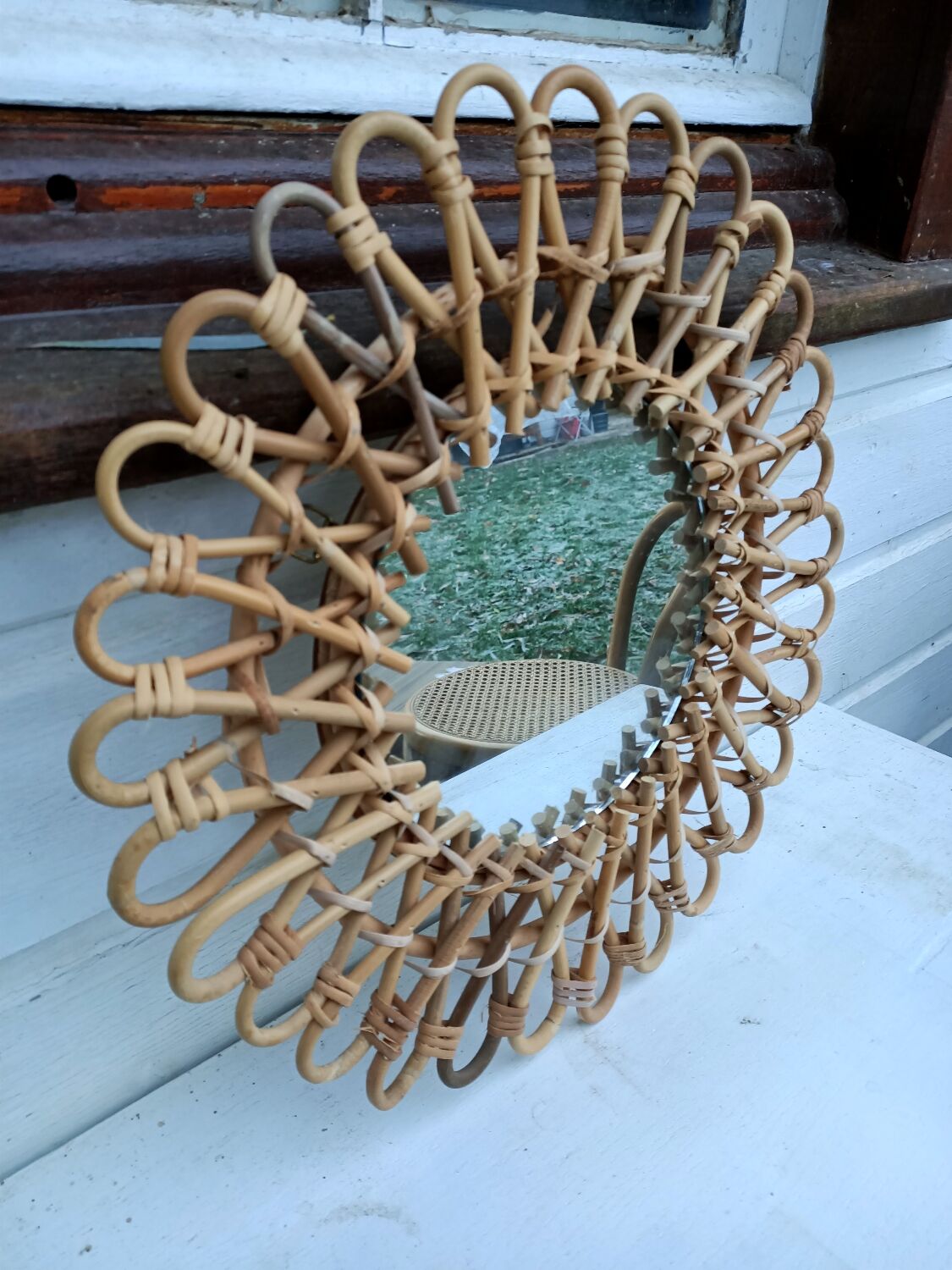 Round rattan mirror