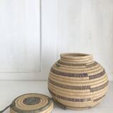 Small round basket in two-tone straw basketry