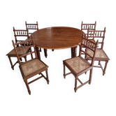 Extendable walnut table, 6 caned chairs in Henri II Neo-Renaissance style.
