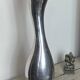 Large organic vase in polished aluminium cast.