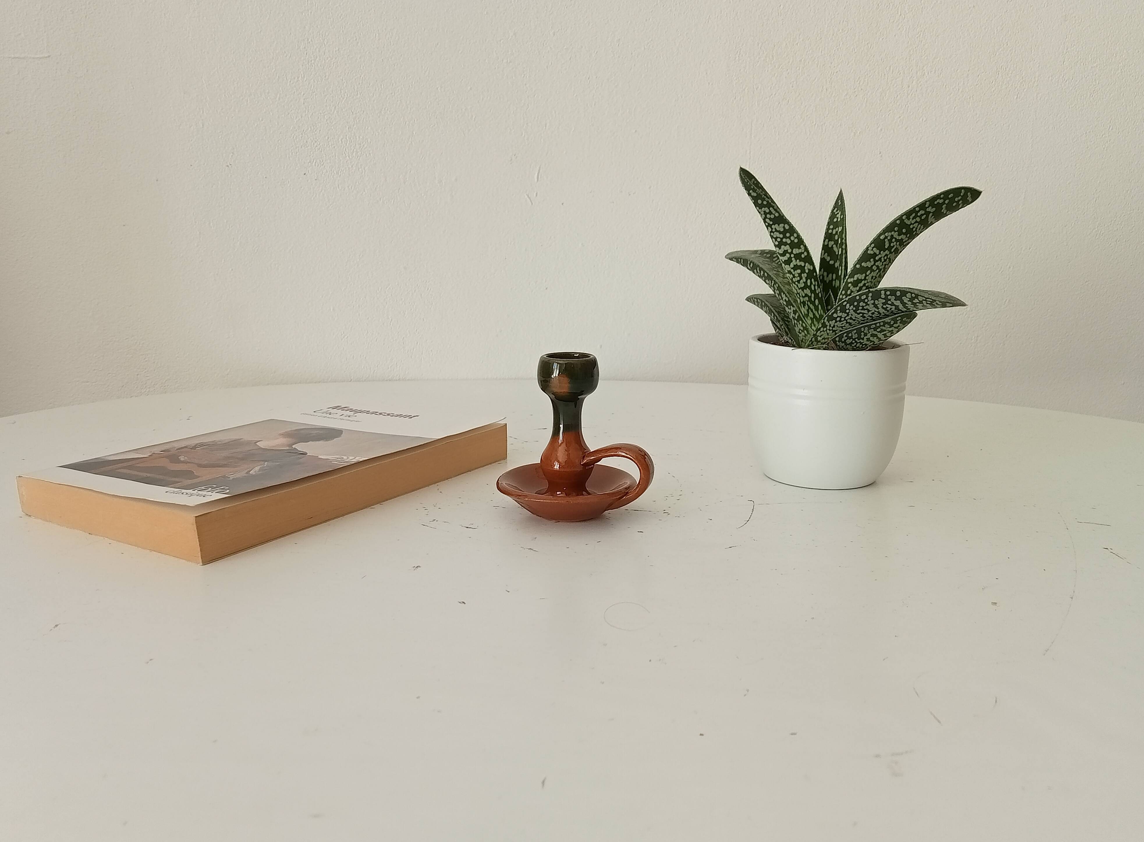 Vintage hand-held candlestick in glazed ceramic