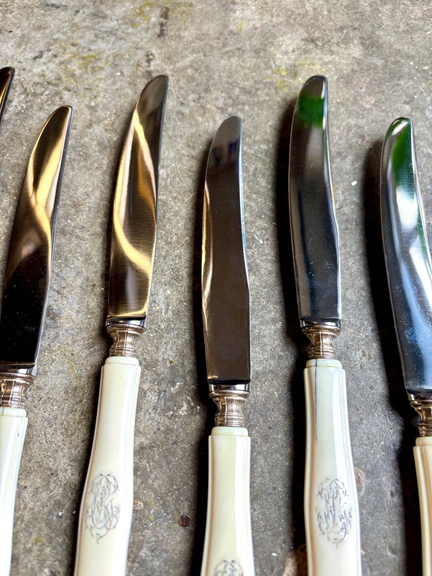 12 stainless steel and monogrammed bone knives