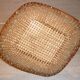 Flat diamond-shaped rattan basket with handle