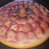 Glazed ceramic dessert plate with strawberry design.