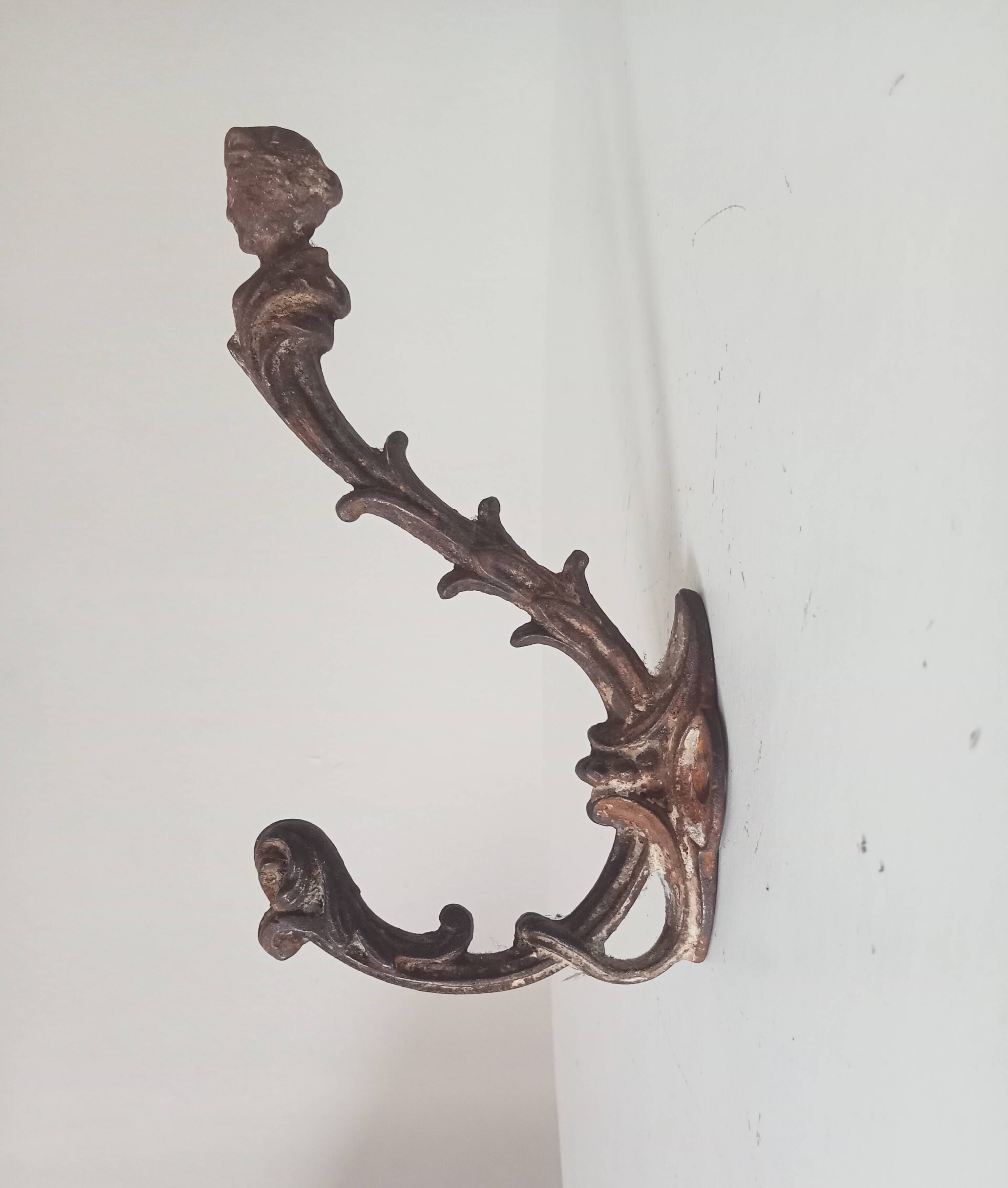 Antique wall coat hook from the 19th century in Victorian cast iron style.