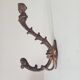 Antique wall coat hook from the 19th century in Victorian cast iron style.