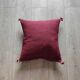 Burgundy Berber cushion with cotton pompom