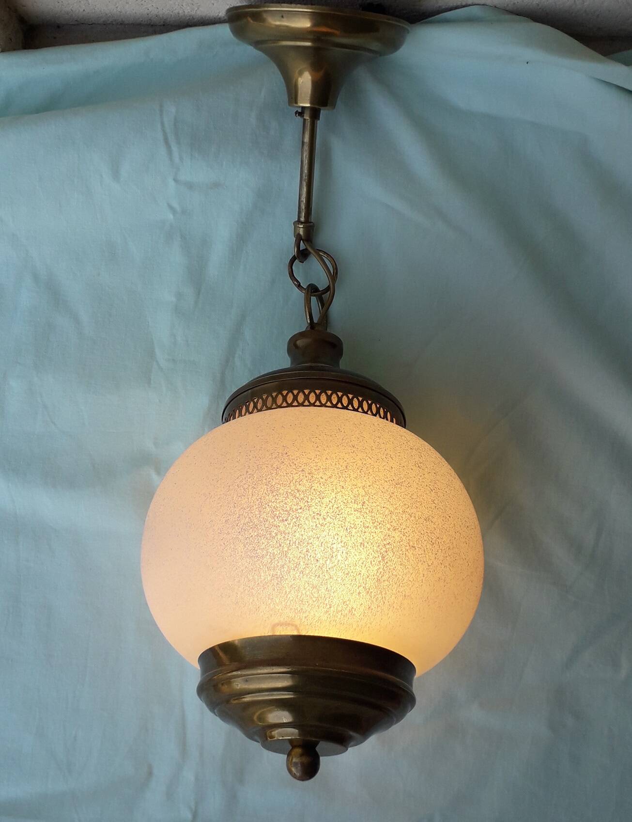Glass and brass suspension