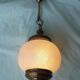 Glass and brass suspension