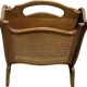 Vintage wicker newspaper rack