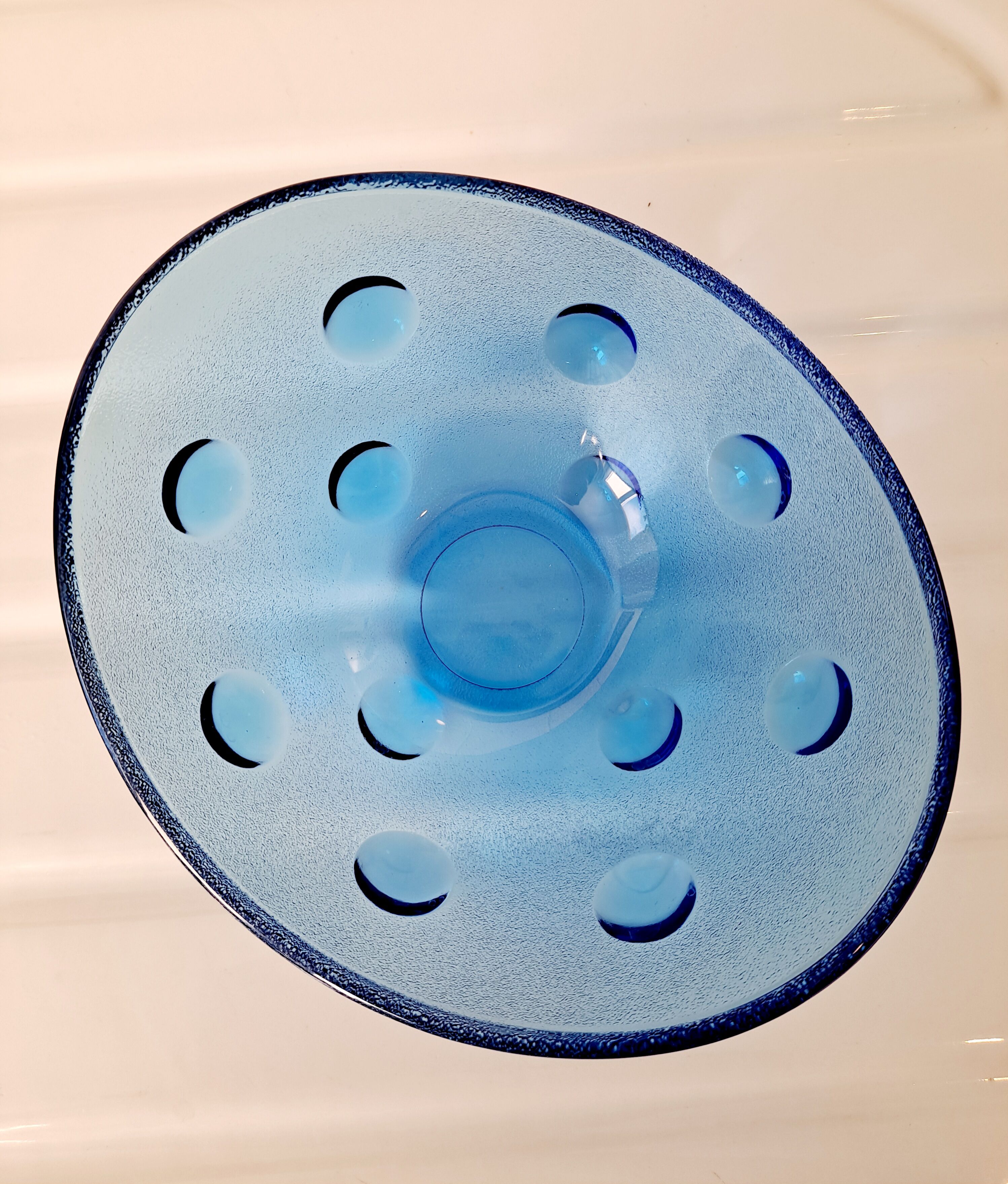 Empty cup blue glass pocket