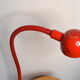 Red articulated clip-on desk lamp vintage