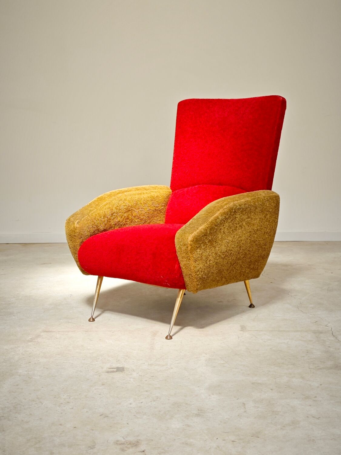 Red and mustard yellow fabric armchair in 1970s style