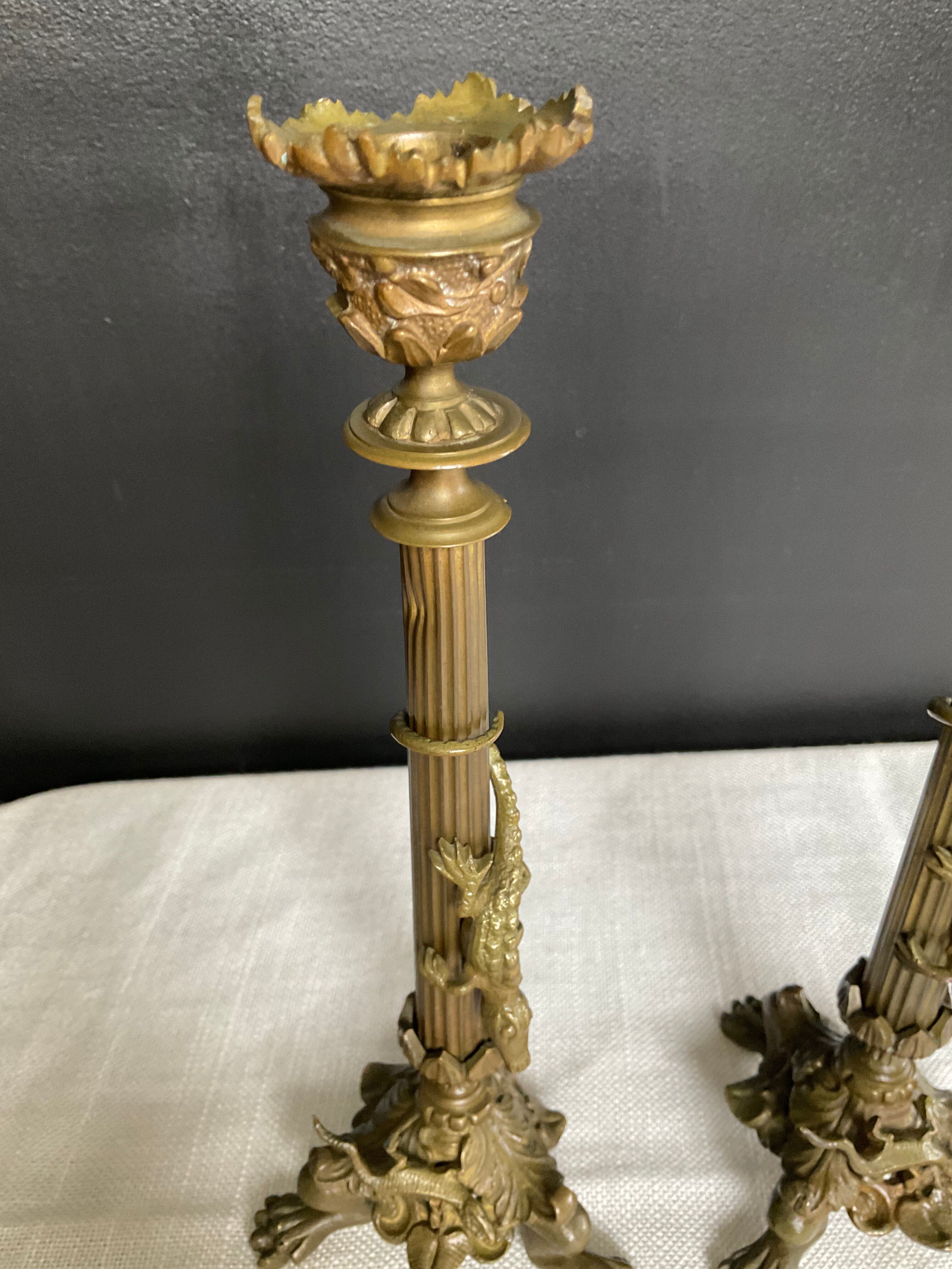 Pair of 19th-century gilded bronze candlesticks in Empire style.