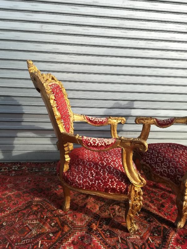 pair of gilded wooden ceremonial chairs