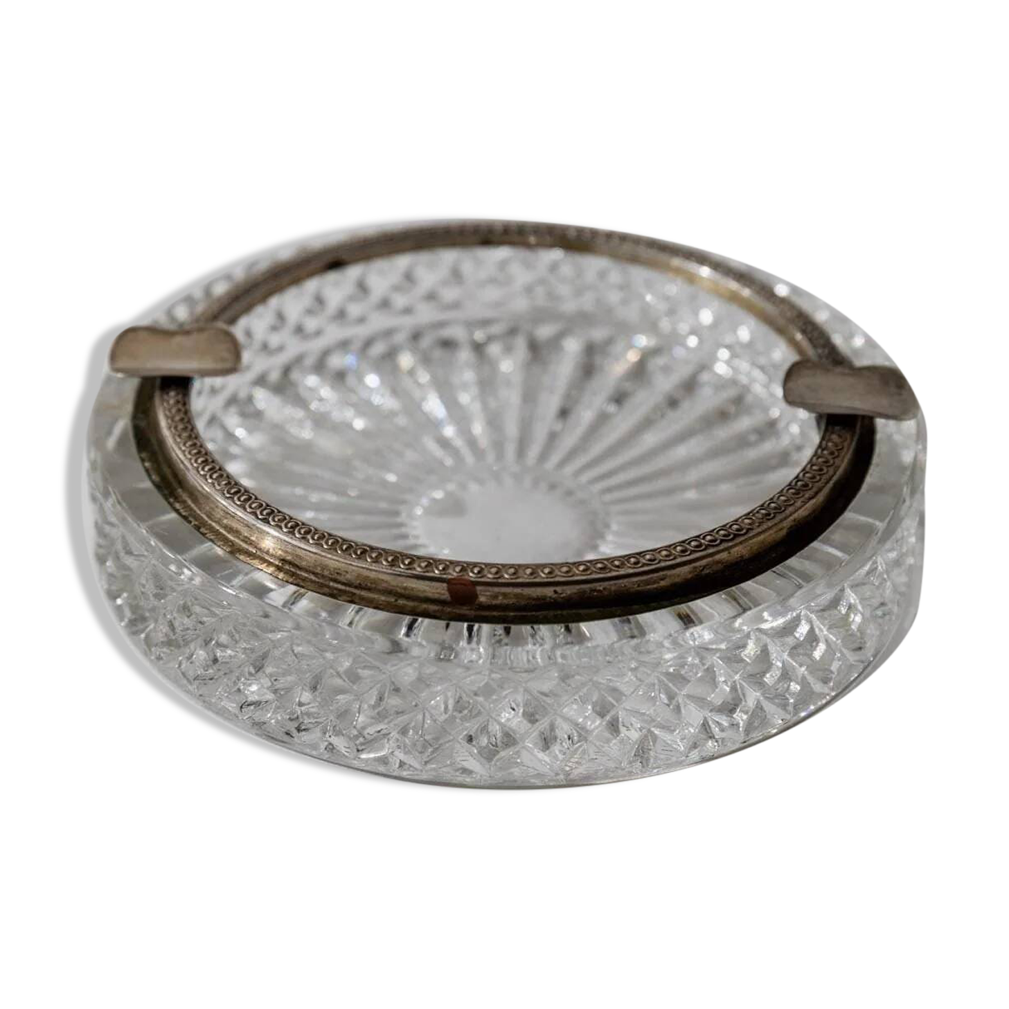 Vintage crystal glass ashtray from the 1920s, silver-edged with a textured pattern, Art Deco table decoration.