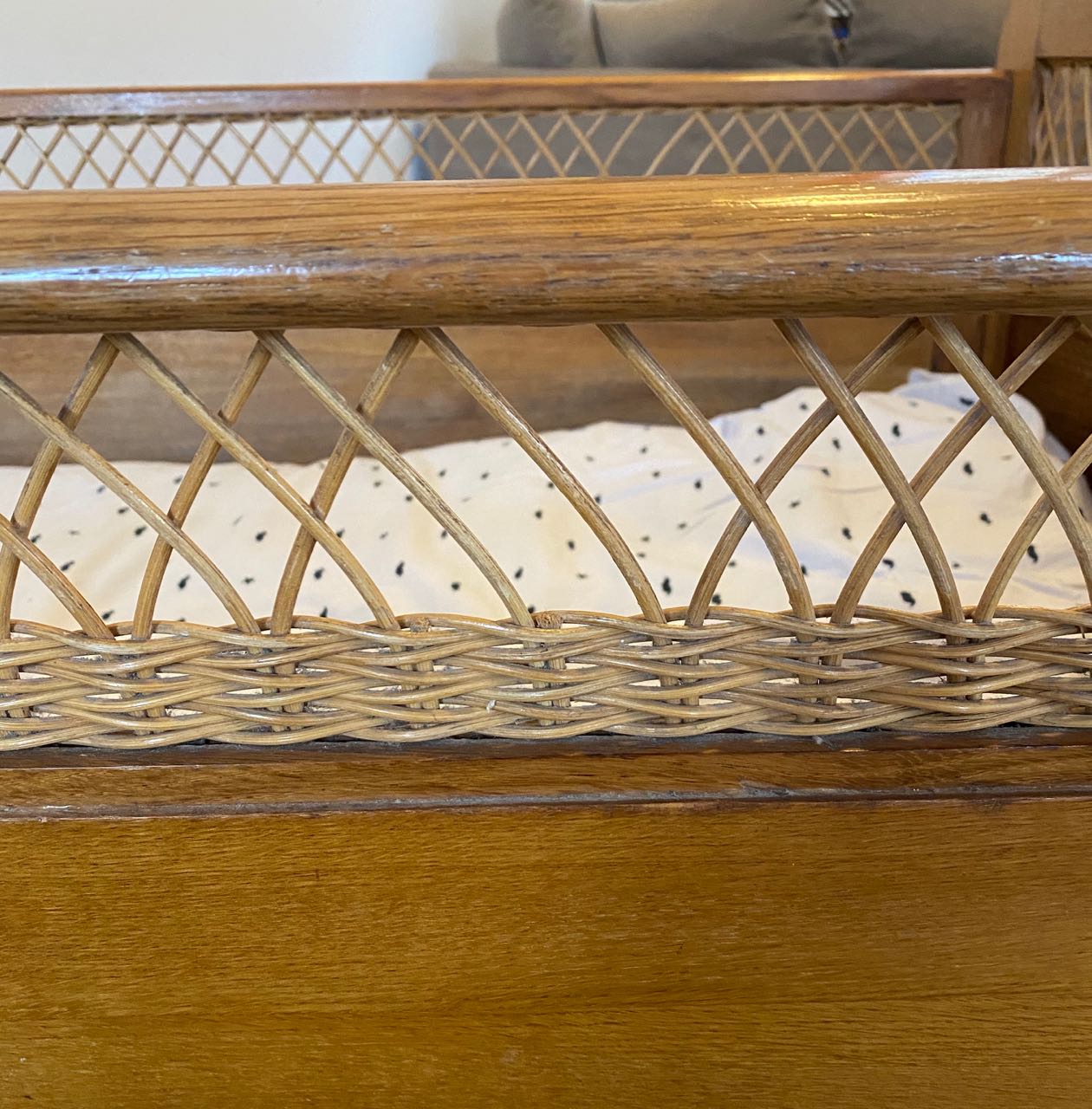 Wooden and wicker baby bed