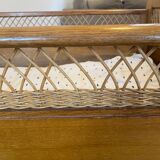 Wooden and wicker baby bed