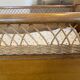 Wooden and wicker baby bed
