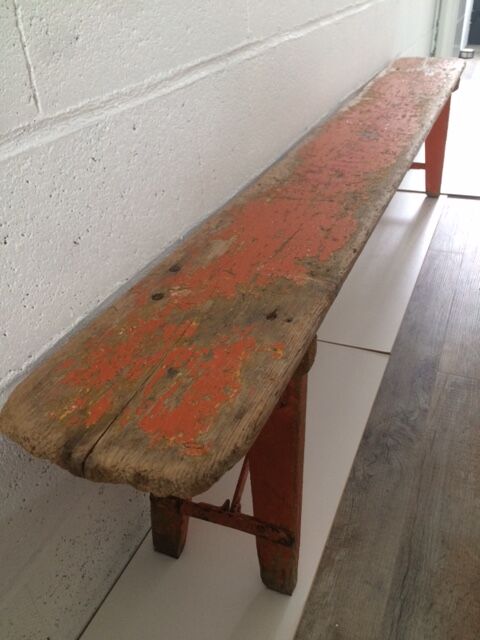 Orange folding wooden bench