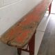 Orange folding wooden bench