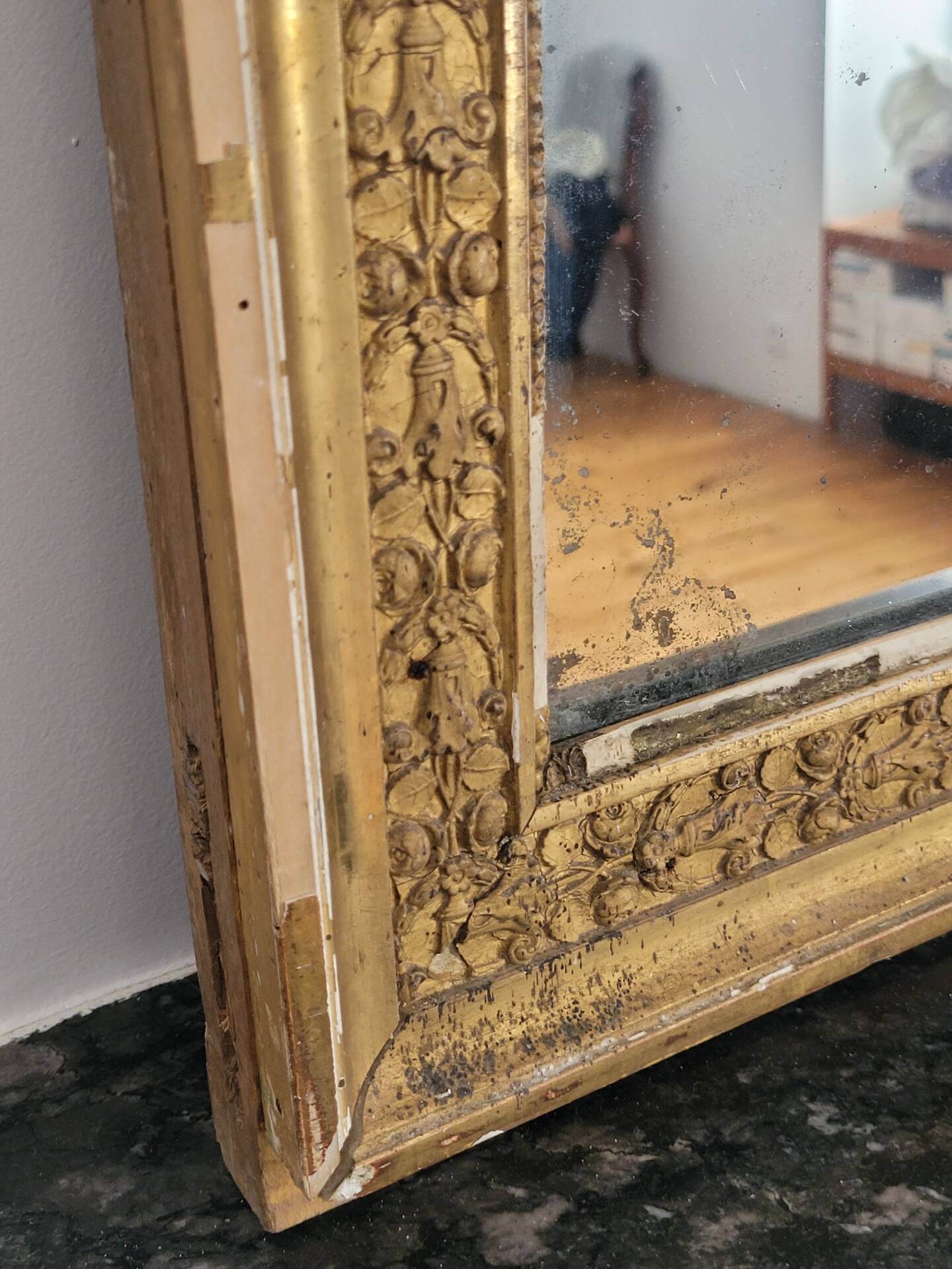 Golden stucco and wood Empire mirror