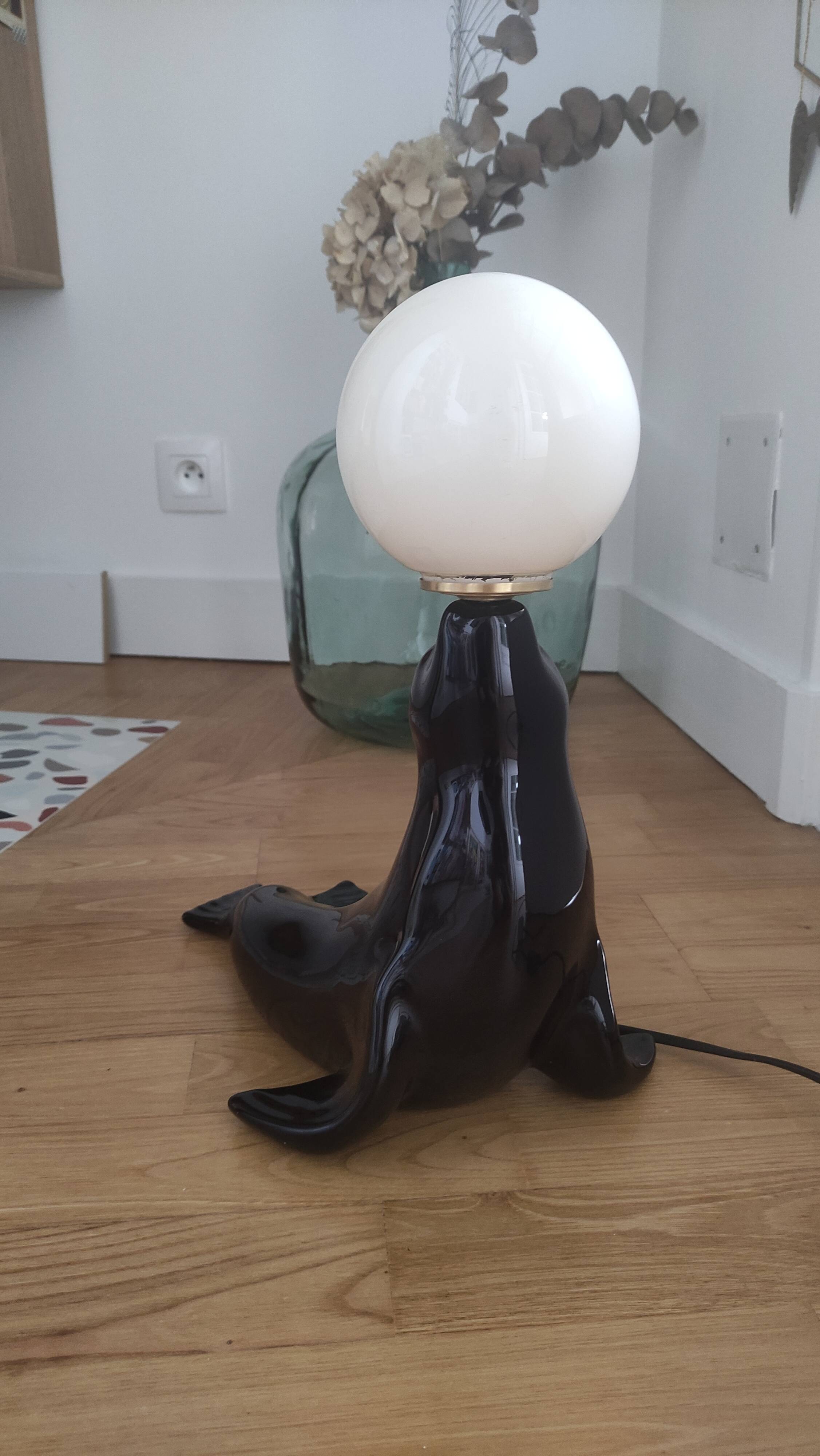 Vintage black sea lion lamp