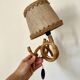 Rattan wall light by Louis Sognot 1960
