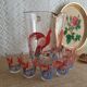 Pitcher and 6 vintage peacock liqueur glasses